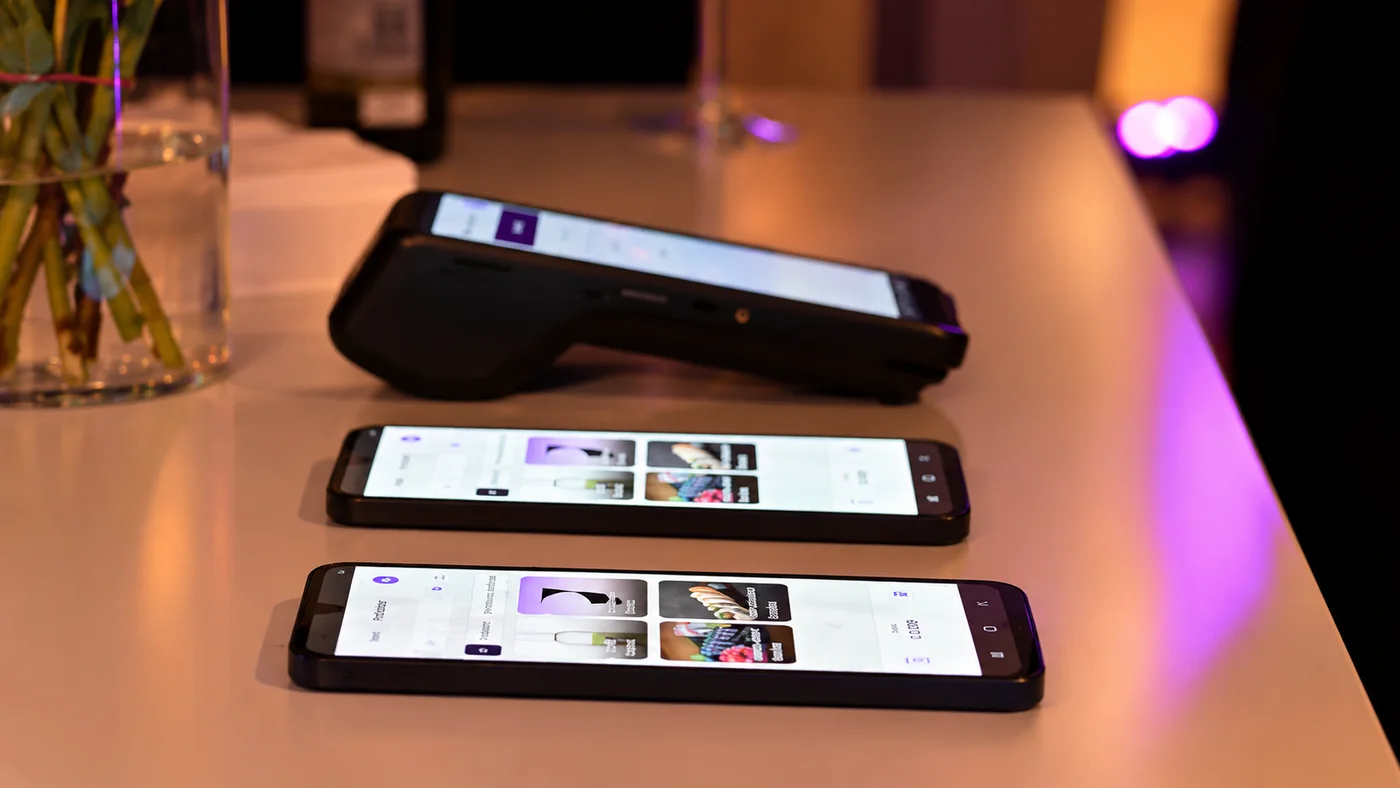 Done Go and two phones running Done Pay & Go on a bar counter
