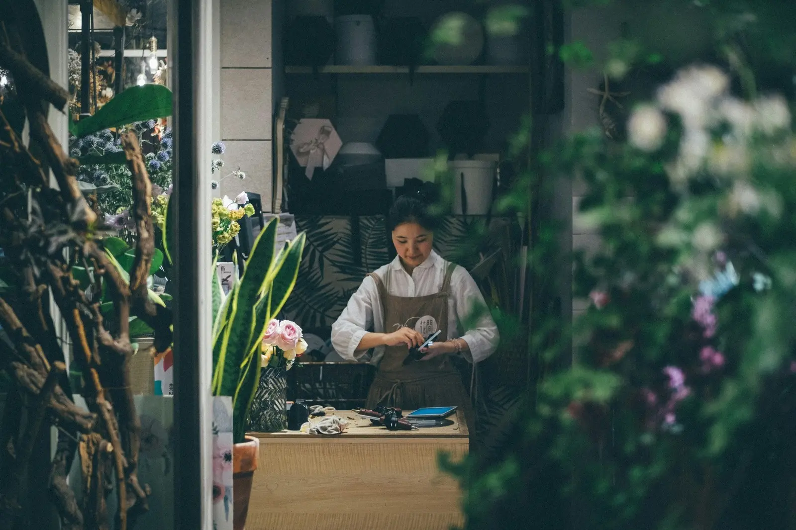 An owner at work in her flower shop